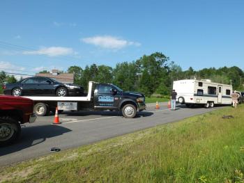 The sedan was towed away by Quick Turn Towing of Damariscotta, while the truck hauling the camper waits for another tow truck to arrive. RYAN LEIGHTON/Boothbay Register