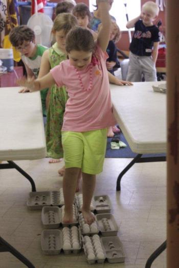 Gracie Greene completes the egg walk successfully. Courtesy of Seeds of Knowledge Education Center