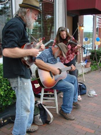 Wiscasset residents Chris Lannon, left, on mandolin, Rick Turcotte on guitar and Liz Lannon on fiddle make music as Turcotte sings a song he wrote. SUSAN JOHNS/Wiscasset Newspaper