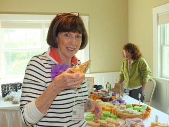 Outgoing president Irene Gerny samples goat milk soap bars at the Vendor's Market during the Garden Club Federation of Maine's 2013 convention at Spruce Point Inn on June 18-20. LISA KRISTOFF/Boothbay Register Outgoing president Irene Gerny samples goat milk soap bars at the Vendor's Market during the Garden Club Federation of Maine's 2013 convention at Spruce Point Inn on June 18-20. LISA KRISTOFF/Boothbay Register