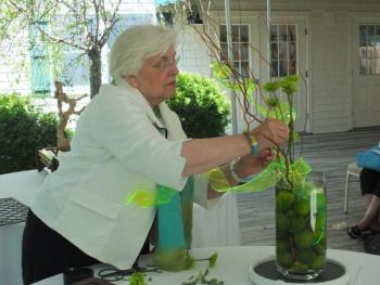 Floral designer and Judges Council member Sandra Leonard, seasonally of Southport, artfully places green chrysanthemums in one of four designs. LISA KRISTOFF/Boothbay Register Floral designer and Judges Council member Sandra Leonard, seasonally of Southport, artfully places green chrysanthemums in one of four designs. LISA KRISTOFF/Boothbay Register
