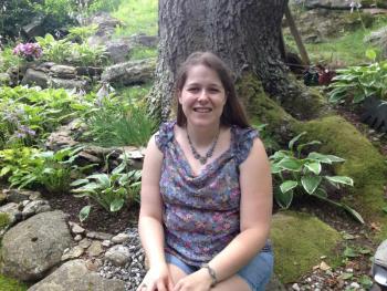 Sarah Duggan in one of her favorite not-so-secret garden spots behind her home in Boothbay Harbor. LISA KRISTOFF/Boothbay Register