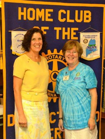 Marty Helman, right, who served as District Governor for Rotary in 2012-13, smiles as she "passes the gavel" to incoming Governor Carolyn Johnson at the Rotary Clubhouse last week. Courtesy of the Boothbay Harbor Rotary Club