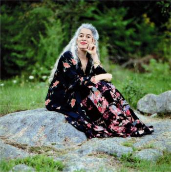 Andrew Goodman on the rocks in the backyard of her Boothbay home. Courtesy of Ruby Throated Spirit