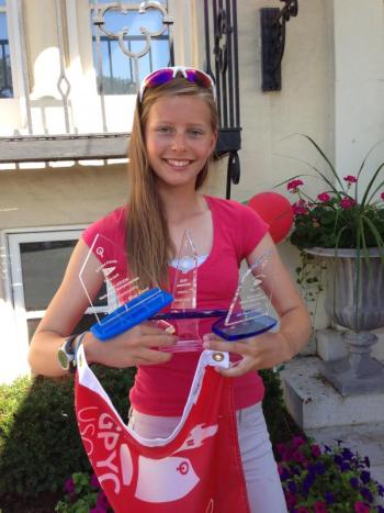 Payton Thompson hold the trophies she won at the National Sailing Championships. Courtesy of Tricia Thompson