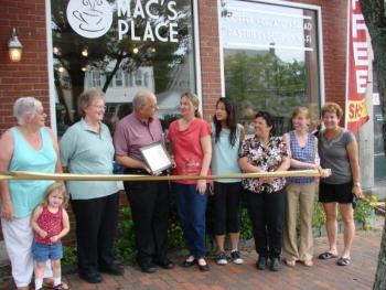 Taking part in a ribbon-cutting on July 1 at Mac's Place are, from left, Wiscasset Selectmen's Vice Chairman Judy Colby with granddaughter Dezirae Colby, Le Garage owner and Wiscasset Area Chamber of Commerce board member Cheryl Rust, Selectmen's Chairman Ed Polewarczyk, Mac's Place owner Karen McDorr, McDorr's daughter Danielle Sylvain, Selectman Pam Dunning, Town Planner Misty Parker and chamber board member Michelle Peele. SUSAN JOHNS/Wiscasset Newspaper Taking part in a ribbon-cutting on July 1 at Mac's Place are, from left, Wiscasset Selectmen's Vice Chairman Judy Colby with granddaughter Dezirae Colby, Le Garage owner and Wiscasset Area Chamber of Commerce board member Cheryl Rust, Selectmen's Chairman Ed Polewarczyk, Mac's Place owner Karen McDorr, McDorr's daughter Danielle Sylvain, Selectman Pam Dunning, Town Planner Misty Parker and chamber board member Michelle Peele. SUSAN JOHNS/Wiscasset Newspaper