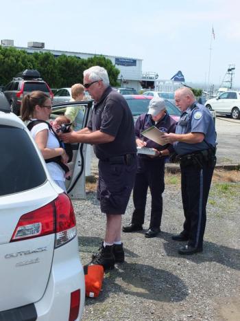 Elizabeth Medina is relieved her two-week-old daughter Sophie is OK after being locked inside a car for 15 minutes. Boothbay Harbor Police Officer Richard Mirabile and paramedics from Boothbay Region Ambulance Service responded to the scene. RYAN LEIGHTON/Boothbay Register
