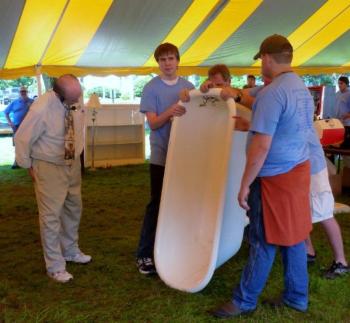 This cast-iron bathtub, which required four people to lift and carry it, sold for $250. KATRINA CLARK/Boothbay Register This cast-iron bathtub, which required four people to lift and carry it, sold for $250. KATRINA CLARK/Boothbay Register
