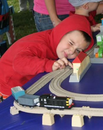 Getting a good look at the toy trains. KEVIN BURNHAM/Boothbay Register