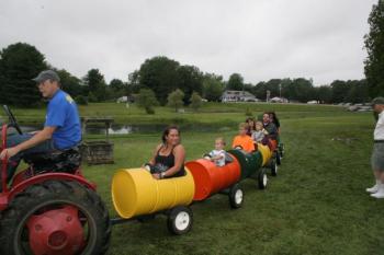 Taking a ride in barrels. KEVIN BURNHAM/Boothbay Register