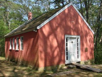The trees and sun work together to make a pretty pattern on the one-room schoolhouse. SUSAN JOHNS/Wiscasset Newspaper