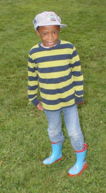 A young Thomas fan wearing Thomas boots on a rainy Friday. KEVIN BURNHAM/Boothbay Register