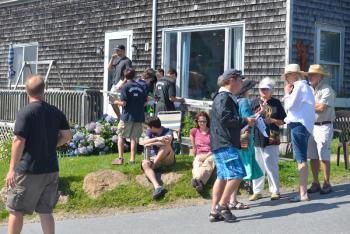 Witnesses and passerby’s gather at the top of the hill on Route 131 in Port Clyde, some waiting to be interviewed by the Knox County Sheriffs Department. (Photo by Ron Hawkes)