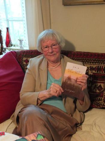 Local poet Ruth Guillard holds her most recent book, “On a Fair Wind.” Her two books can be found at Sherman's Book Store in Boothbay Harbor. RYAN LEIGHTON/Boothbay Register