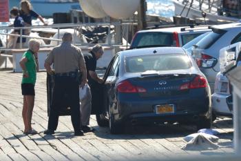 From right, Knox County Sheriff's Lt. Kirk Guerette, Sgt. John Palmer and car driver Cheryl Torgerson of New York City. (Photo by Ron Hawkes)