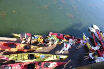 Brightly colored kayaks filled the Newagen town dock as paddlers prepare for the start of the 20th annual Rowgatta. SUE MELLO/Boothbay Register