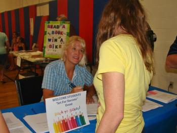 Jean Duncan signs up a customer at last year's Set for Success event. KEVIN BURNHAM/Boothbay Register