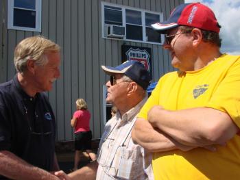 U.S. Sen. Angus King, left, I-Maine, chats with Ted Poirier of Dayton and Toby Guimond of East Waterboro. SUSAN JOHNS/Wiscasset Newspaper