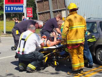 Emergency personnel work to remove the driver of the Mercury station wagon. GARY DOW/Boothbay Register