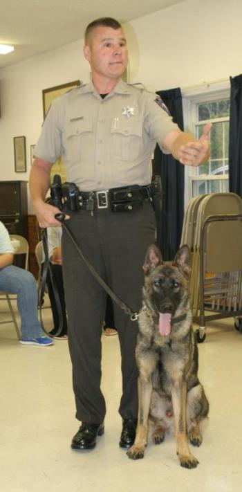 Patrol deputy Kevin Dennison explains the training that Duke, one of the Lincoln County Sheriff’s Office’s dogs, has to complete before becoming certified. Dennison and Duke were special guests at the Hometown Heroes event. KEVIN BURNHAM/Boothbay Register 