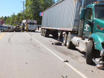 The front right wheel from the Mercury rests alongside of the Boothbay Region Refuse Disposal District truck. GARY DOW/Boothbay Register