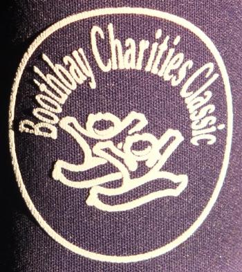 The insignia of the Boothbay Charities Classic is featured on a foam koozie. RYAN LEIGHTON/Boothbay Register