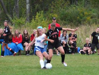 Sinead Miller grapples with a Lisbon defender. RYAN LEIGHTON/Boothbay Register