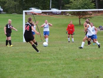 A Lisbon striker takes aim and fires a shot on goal. RYAN LEIGHTON/Boothbay Register