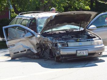 A Mercury station wagon sits along Route 27 in front of T&D Variety in Boothbay after an accident Wednesday, Sept. 4. GARY DOW/Boothbay Register