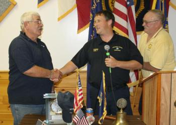 Allan Hitt, left, is honored by Robbie Ham, center, Boothbay Region Ambulance Service director, at the Hometown Heroes event held at the American Legion Hall on September 12. Hitt joined the BRAS in 1976 and retired in 2012. At right is Rotarian Daren Graves, who organizes the annual event with his wife, Debbie. KEVIN BURNHAM/Boothbay Register