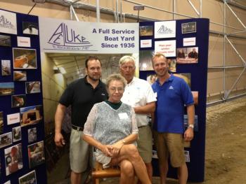 East Boothbay’s Paul E. Luke boatyard hosts Boothbay Region Chamber of Commerce Business After Hours event. In this photo Nora Luke, seated, is surrounded by her sons Keith, left, and Andy, right, and her husband Frank Luke.   