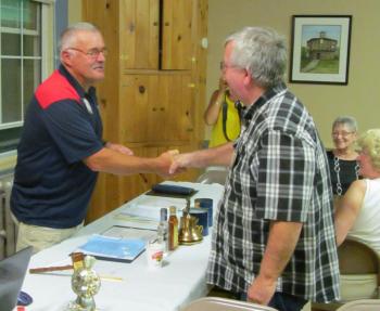 King Lion Mike Giles, left, presents Lion Tom Nickerson with the Lions Club Membership Key Award. Courtesy of John Platt