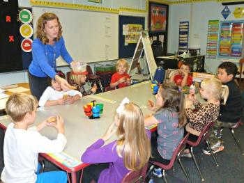 New first grade teacher Lindsey Ingraham, passing homemade cookies to her students. Clockwise from rear are: Angelina Patriotti, Anna Elizarkov, Lysander LeFerre, Dean Brewer, Zaid Osman, Lilliana Nein, Scarlett O'Brien, Madeline Orchard, and Wyatt Lorrain. KATRINA CLARK/Boothbay Register New first grade teacher Lindsey Ingraham, passing homemade cookies to her students. Clockwise from rear are: Angelina Patriotti, Anna Elizarkov, Lysander LeFerre, Dean Brewer, Zaid Osman, Lilliana Nein, Scarlett O'Brien, Madeline Orchard, and Wyatt Lorrain. KATRINA CLARK/Boothbay Register