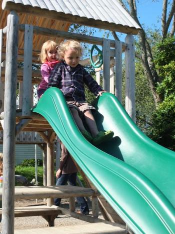 Karen Higgins and Carter Wilson prepare to slide. RYAN LEIGTON/Boothbay Register