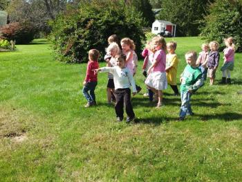 A group of children congregate to count the boxcars on the passing train. RYAN LEIGHTON/Boothbay Register