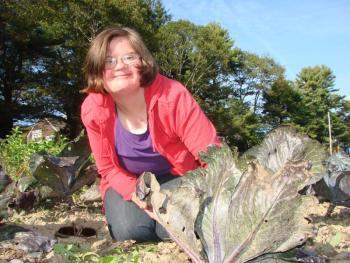 Anna McDougal of Wiscasset looks up from weeding rows of chard at Buckwheat Blossom Farm. She has a new book out, about her life with Down Syndrome. SUSAN JOHNS/Wiscasset Newspaper