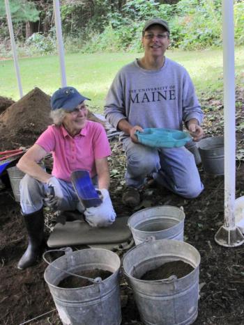 Archaeologist Tim Dinsmore and volunteer Betsy Evans of Newcastle discuss progress at an archeology site that dates back to the birth of shipbuilding on the Damariscotta River. Courtesy of Alan Crowell