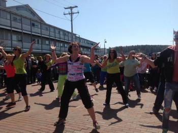 Sarah Brewer, center, leading a Zumba flash mob at the 2013 Fishermen's Festival. From left, students are Laurie Dickinson, Julie Higgins, Nicci Manson Doray, Kathleen Lamothe, Debbie Bailey Speed, Eileen Higgins, and Whitney Spaulding Wright. Courtesy of Robert Brewer