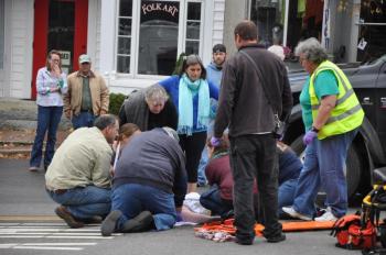CREWS WORKED quickly to secure a woman who had been struck by a flatbed truck Thursday morning in Wiscasset. The woman was rushed to Maine Medical via Wiscasset Ambulance. BEN BULKELEY/Wiscasset Newspaper