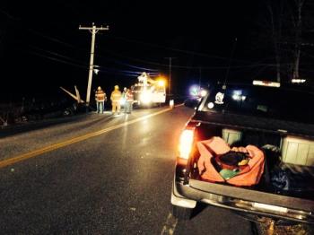 Central Maine Power workers attempt to restore power after a car clipped a utility pole on November 13. MIKE MARR/Boothbay Register