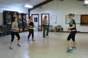 Students Brigitte Schlosser, Julie Coffin and Kristen Campbell follow along to Sarah Gudroe’s teaching. KATRINA CLARK/Boothbay Register
