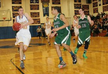 John Hepburn drives to the basket in Thursday’s game against Spruce Mountain. Hepburn scored 32 points to lead Boothbay in the double-overtime victory. KEVIN BURNHAM/Boothbay Register Hepburn, John