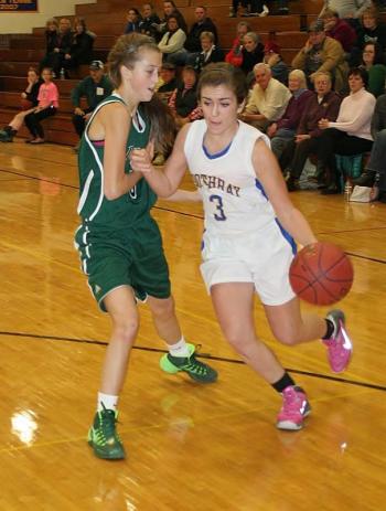 Junior guard Ashley Reed drives to the basket against Spruce Mountain guard Alex Bessey during the final quarter of Wednesday’s game at Boothbay Region High School. KEVIN BURNHAM/Boothbay Register Reed
