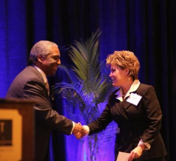 Lincoln County Healthcare Senior V.P. of Hospital Operations Cindy Wade accepts the award on behalf of LincolnHealth from presenter Vernon Williams. Courtesy of Scott Shott Wade, LincolnHealth