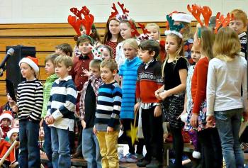 Second graders sports antlers singing “Must Be Santa” at the holiday concert at BRES. KATRINA CLARK/Boothbay Register