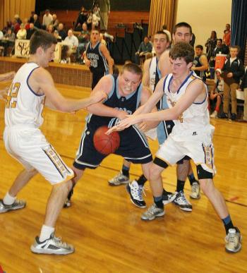 Brad Drummond, left, and Nick Gorey battle Dirigo’s Tyler Frost for possession of the ball during the first half of Wednesday’s game at Boothbay Region High School. KEVIN BURNHAM/Boothbay Register Dirigo, Boothbay