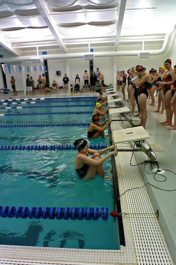 Starting position for the girls 100-yard backstroke. From top to bottom: Audrey Jones of Winslow, Elizabeth Gilbert of Lincoln Academy, Chelsea Graves of Boothbay Region High School, Courtney of Colford of Winslow, and Thalia Eddy-Blouin of Lincoln Academy. KATRINA CLARK/Boothbay Register