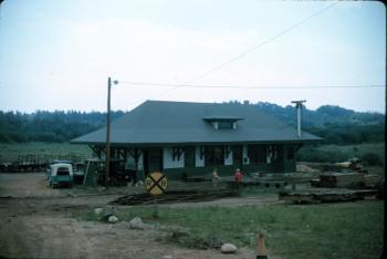 Photo taken in spring or early summer of 1964 after Freeport Station had been moved to Boothbay. Early work on the railroad tracks can be seen in the foreground.