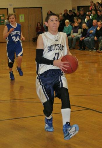 Keegan Giles goes in for an easy layup for the eighth grade boys in Thursday’s game against Bristol. KEVIN BURNHAM/Boothbay Register Giles