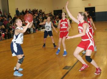 Eighth grader Sydney Mercier lines up a shot against Camden on Thursday. KEVIN BURNHAM/Boothbay Register Mercier
